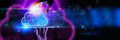 Hand holding up laptop with screen overlaid by cloud image, Cloud Advisory Services | DXC Technology